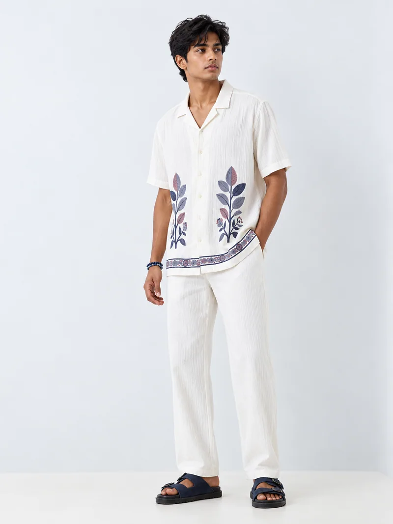 Resort embroidered shirt fashion look on Indian-looking model