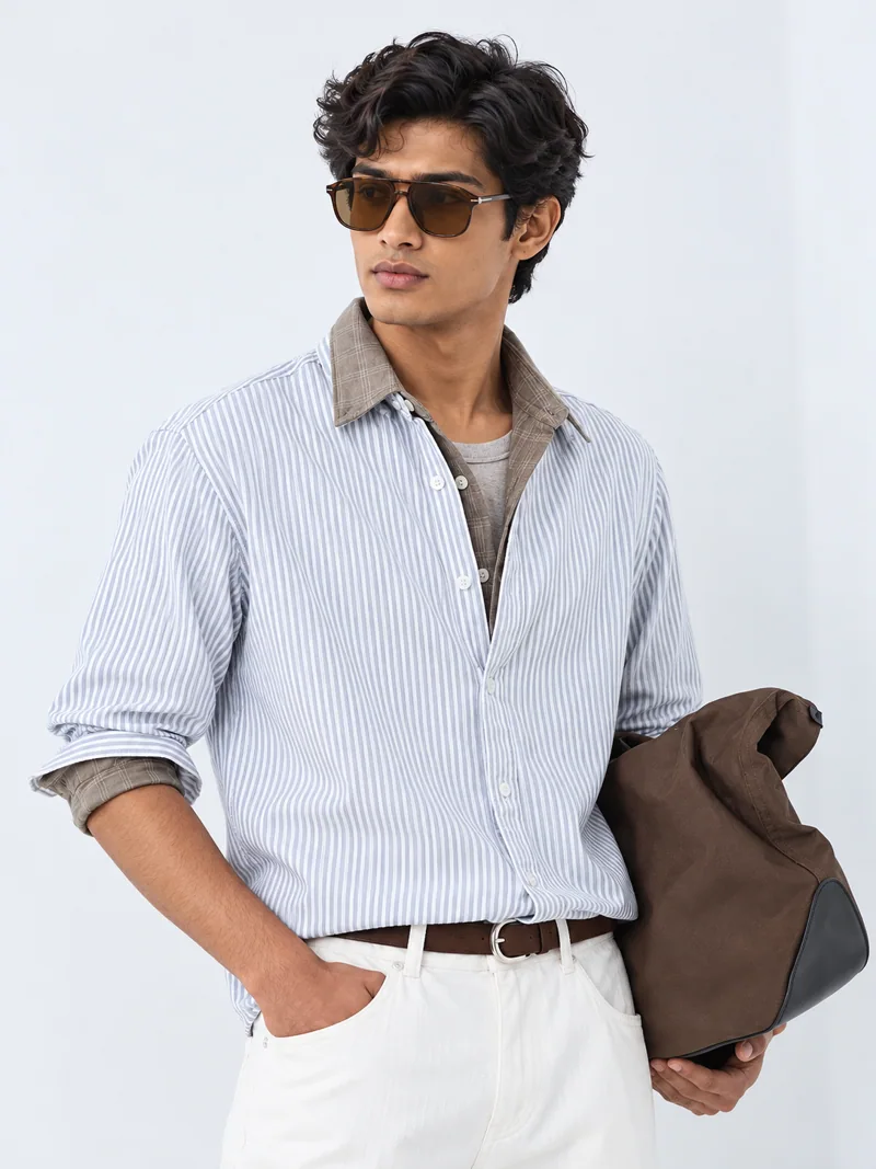 Layered woven shirt fashion look on Indian-looking model