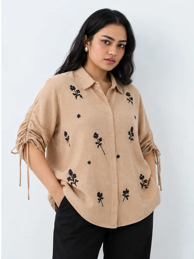 Beige embroidered blouse fashion look on Indian-looking model